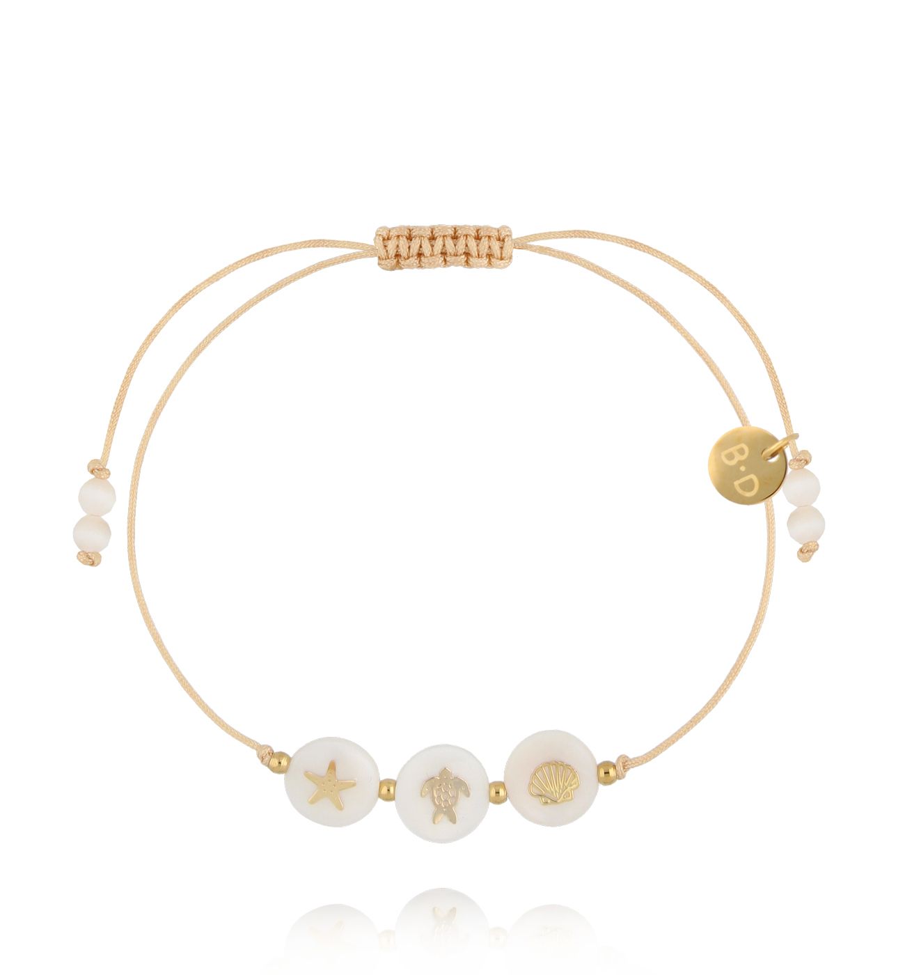 Bransoletka z beżowym sznurkiem i trzema elementami z symbolem morza BMT0342
